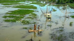 Flood-affected people move on banana rafts, following incessant rain in Nalbari district on Friday.(PTI File Photo) Flood-affected people move on banana rafts, following incessant rain in Nalbari district on Friday.(PTI File Photo)