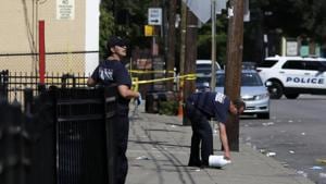 Cincinnati firefighters use bleach to clean and remove pools of blood left at the scene of a mass shooting near Grant Park in the Over-the-Rhine neighborhood of Cincinnati on Sunday.(AP Photo) Cincinnati firefighters use bleach to clean and remove pools of blood left at the scene of a mass shooting near Grant Park in the Over-the-Rhine neighborhood of Cincinnati on Sunday.(AP Photo)
