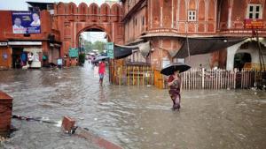 People wade through an inundated street during heavy rains, in Jaipur, Rajasthan. (Photo by Himanshu Vyas / Hindustan Times) People wade through an inundated street during heavy rains, in Jaipur, Rajasthan. (Photo by Himanshu Vyas / Hindustan Times)
