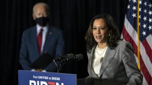 Democratic presidential candidate former Vice President Joe Biden stands left as his running mate Sen. Kamala Harris, D-Calif., speaks at the Hotel DuPont in Wilmington.(AP) Democratic presidential candidate former Vice President Joe Biden stands left as his running mate Sen. Kamala Harris, D-Calif., speaks at the Hotel DuPont in Wilmington.(AP)