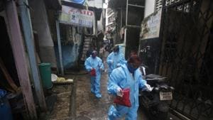 Community health workers arrive to screen people for Covid-19 symptoms in Dharavi, one of Asia's biggest slums, in Mumbai.(AP) Community health workers arrive to screen people for Covid-19 symptoms in Dharavi, one of Asia's biggest slums, in Mumbai.(AP)
