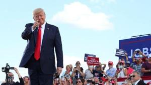 US President Donald Trump gestures in front of supporters at Basler Flight Service in Oshkosh, Wisconsin, US(Reuters) US President Donald Trump gestures in front of supporters at Basler Flight Service in Oshkosh, Wisconsin, US(Reuters)