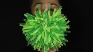 Edmond Kok, a Hong Kong theatre costume designer and actor, wearing a spiky green mask which is a 3D visualisation of corona virus in Hong Kong Thursday, Aug. 6, 2020.(AP Photo/Vincent Yu) Edmond Kok, a Hong Kong theatre costume designer and actor, wearing a spiky green mask which is a 3D visualisation of corona virus in Hong Kong Thursday, Aug. 6, 2020.(AP Photo/Vincent Yu)