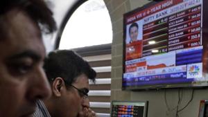 Indian stockbrokers watch the Bombay Stock Exchange (BSE) index on a trading terminal in Mumbai(AP photo) Indian stockbrokers watch the Bombay Stock Exchange (BSE) index on a trading terminal in Mumbai(AP photo)