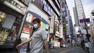 A man walks by restaurants in the Shinjuku district of Tokyo on Monday.(AP Photo) A man walks by restaurants in the Shinjuku district of Tokyo on Monday.(AP Photo)