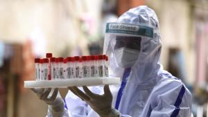 A health worker handles samples collected for Reverse transcription-polymerase chain reaction (RT-PCR) based coronavirus testing at an Anganwadi center in Amar Colony, Gurugram on Tuesday.(Parveen Kumar/HT Photo) A health worker handles samples collected for Reverse transcription-polymerase chain reaction (RT-PCR) based coronavirus testing at an Anganwadi center in Amar Colony, Gurugram on Tuesday.(Parveen Kumar/HT Photo)