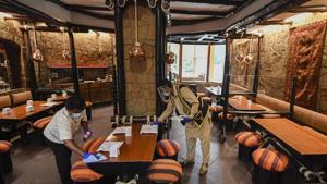 Staff sanitise a restaurant in New Delhi.(PTI) Staff sanitise a restaurant in New Delhi.(PTI)