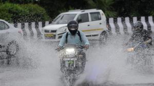 A motorcyclist passes through a heavily waterlogged stretch of road, at Sector 95, in Noida on Wednesday.(Sunil Ghosh/HT Photo) A motorcyclist passes through a heavily waterlogged stretch of road, at Sector 95, in Noida on Wednesday.(Sunil Ghosh/HT Photo)