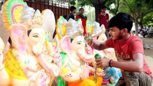 Bathinda, India - August 19, 2020: A craftsman gives final touches to Lord Ganesha idols ahead of the upcoming Ganesh Chaturthi festival, in Bhatinda, Punjab, India, on Wednesday, August 19, 2020.(Sanjeev Kumar/Hindustan Times) Bathinda, India - August 19, 2020: A craftsman gives final touches to Lord Ganesha idols ahead of the upcoming Ganesh Chaturthi festival, in Bhatinda, Punjab, India, on Wednesday, August 19, 2020.(Sanjeev Kumar/Hindustan Times)