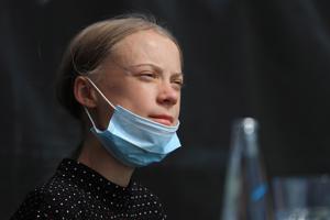 Greta Thunberg, climate activist, pauses during a news conference on the roof of the House of World Cultures in Berlin, Germany, on Thursday, Aug. 20, 2020. Angela Merkel and other political leaders must treat climate-related issues as an emergency, activist Greta Thunberg said on Thursday after meeting the German chancellor in Berlin.(Bloomberg)