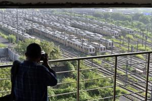 A man photographs Delhi Metro yellow line trains parked at Khyber Pass Metro Depot, in New Delhi.(Ajay Aggarwal /HT PHOTO) A man photographs Delhi Metro yellow line trains parked at Khyber Pass Metro Depot, in New Delhi.(Ajay Aggarwal /HT PHOTO)