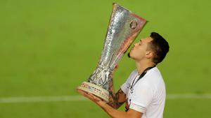 Sevilla's Lucas Ocampos celebrates winning the Europa League Final with the trophy.(REUTERS) Sevilla's Lucas Ocampos celebrates winning the Europa League Final with the trophy.(REUTERS)
