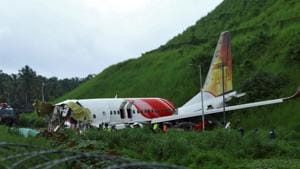 Officials inspect the site where a passenger plane crashed when it overshot the runway at the Calicut International Airport in Karipur, in the southern state of Kerala.(REUTERS) Officials inspect the site where a passenger plane crashed when it overshot the runway at the Calicut International Airport in Karipur, in the southern state of Kerala.(REUTERS)