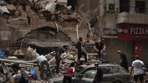 People remove debris from a house damaged by the August 4 explosion that hit the seaport of Beirut, Lebanon.(AP Photo) People remove debris from a house damaged by the August 4 explosion that hit the seaport of Beirut, Lebanon.(AP Photo)
