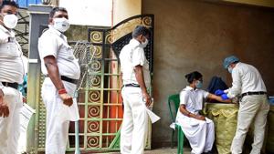 West Bengal, Aug 23 (ANI): Health worker collects a blood sample from police personnel for the COVID-19 test, in Kolkata on Sunday. (ANI Photo)(ANI) West Bengal, Aug 23 (ANI): Health worker collects a blood sample from police personnel for the COVID-19 test, in Kolkata on Sunday. (ANI Photo)(ANI)