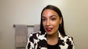 Alexandria Ocasio-Cortez guides viewers on her skincare regime and her signature red lipstick.(Vogue/YouTube Screen Grab) Alexandria Ocasio-Cortez guides viewers on her skincare regime and her signature red lipstick.(Vogue/YouTube Screen Grab)