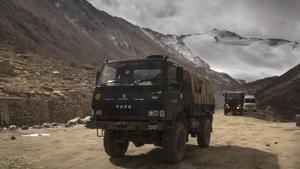 Indian Army vehicles drive on a road in Ladakh region near the border with China(AP) Indian Army vehicles drive on a road in Ladakh region near the border with China(AP)