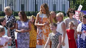First lady Melania Trump visits an exhibit of artwork by young artists in celebration of the 100th anniversary of the 19th amendment which afforded the vote to women, at the White House in Washington, Monday, Aug. 24, 2020. She is joined by, from left, Education Secretary Betsy Devos, Second Lady Karen Pence, and Transportation Secretary Elaine Chao.(AP Photo/J. Scott Applewhite) First lady Melania Trump visits an exhibit of artwork by young artists in celebration of the 100th anniversary of the 19th amendment which afforded the vote to women, at the White House in Washington, Monday, Aug. 24, 2020. She is joined by, from left, Education Secretary Betsy Devos, Second Lady Karen Pence, and Transportation Secretary Elaine Chao.(AP Photo/J. Scott Applewhite)