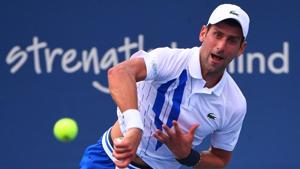 Aug 25, 2020; Flushing Meadows, New York, USA; Novak Djokovic (SRB) hits the ball against Tennys Sandgren (USA) during the Western & Southern Open at the USTA Billie Jean King National Tennis Center. Mandatory Credit: Robert Deutsch-USA TODAY Sports(USA TODAY Sports) Aug 25, 2020; Flushing Meadows, New York, USA; Novak Djokovic (SRB) hits the ball against Tennys Sandgren (USA) during the Western & Southern Open at the USTA Billie Jean King National Tennis Center. Mandatory Credit: Robert Deutsch-USA TODAY Sports(USA TODAY Sports)