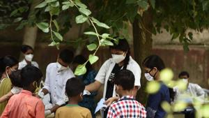 A health worker distributes face masks to children during a coronavirus testing drive, at Ayushman Bharat Health and Wellness Centre, in Gurugram in July. The National Health Authority ) that is the implementing authority of the country’s flagship public health insurance scheme --- Ayushman Bharat Pradhan Mantri Jan Arogya Yojna --- has released the draft policy for public comments and feedback until September 3.(Parveen Kumar/HT Photo) A health worker distributes face masks to children during a coronavirus testing drive, at Ayushman Bharat Health and Wellness Centre, in Gurugram in July. The National Health Authority ) that is the implementing authority of the country’s flagship public health insurance scheme --- Ayushman Bharat Pradhan Mantri Jan Arogya Yojna --- has released the draft policy for public comments and feedback until September 3.(Parveen Kumar/HT Photo)