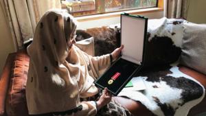 Ambreen Naeem holds a medal which was posthumously awarded to her husband Mian Naeem Rashid for bravery, after being killed charging the attacker at an attack on Al Noor mosque in March in Christchurch, New Zealand on June 13, 2019.(Reuters Photo) Ambreen Naeem holds a medal which was posthumously awarded to her husband Mian Naeem Rashid for bravery, after being killed charging the attacker at an attack on Al Noor mosque in March in Christchurch, New Zealand on June 13, 2019.(Reuters Photo)