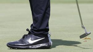 Aug 27, 2020; Olympia Fields, Illinois, USA; A close up of Cameron Champ's shoes as he wears a white shoe on the right foot and a black shoe on the left with messages written in support of Black Lives Matter during the first round of the BMW Championship golf tournament at Olympia Fields Country Club - North.(USA TODAY Sports) Aug 27, 2020; Olympia Fields, Illinois, USA; A close up of Cameron Champ's shoes as he wears a white shoe on the right foot and a black shoe on the left with messages written in support of Black Lives Matter during the first round of the BMW Championship golf tournament at Olympia Fields Country Club - North.(USA TODAY Sports)