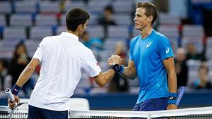 Novak Djokovic of Serbia shakes hands with Vasek Pospisil of Canada during a Shanghai Rolex Masters match.(Getty Images) Novak Djokovic of Serbia shakes hands with Vasek Pospisil of Canada during a Shanghai Rolex Masters match.(Getty Images)