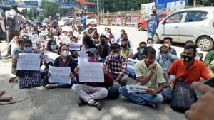 A section of the 1,600 support staff for the new foreigners’ tribunals in Assam protesting in Guwahati seeking release of their appointment letters.(HT PHOTO)