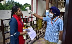 A candidate undergoing a temperature check before being allowed in to take the Joint Entrance Examination (JEE), Mains, at a centre on Albert Road in Amritsar on Tuesday morning.(Sameer Sehgal/HT) A candidate undergoing a temperature check before being allowed in to take the Joint Entrance Examination (JEE), Mains, at a centre on Albert Road in Amritsar on Tuesday morning.(Sameer Sehgal/HT)