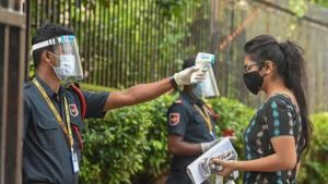 A students undergoes thermal screening as she enters an examination centre to appear for JEE in Kolkata on September 1, 2020.(PTI) A students undergoes thermal screening as she enters an examination centre to appear for JEE in Kolkata on September 1, 2020.(PTI)