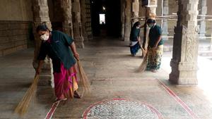 Premises of Meenakshi Amman temple being sanitized, in view of Covid-19, as All places of worship to reopen in the state from today.(ANI) Premises of Meenakshi Amman temple being sanitized, in view of Covid-19, as All places of worship to reopen in the state from today.(ANI)