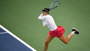 Garbine Muguruza of Spain hits a backhand against Nao Hibino of Japan.(Reuters) Garbine Muguruza of Spain hits a backhand against Nao Hibino of Japan.(Reuters)