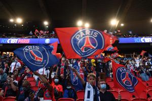 Paris Saint-Germain (PSG) supporters cheer for their team as they watch at the Parc des Princes.(AFP) Paris Saint-Germain (PSG) supporters cheer for their team as they watch at the Parc des Princes.(AFP)