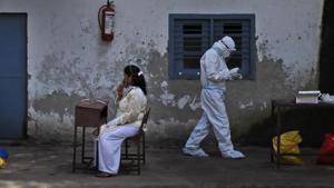 A health worker returns after taking a nasal swab sample to test for Covid-19 in New Delhi, India, Tuesday, Sept. 1, 2020.(AP photo) A health worker returns after taking a nasal swab sample to test for Covid-19 in New Delhi, India, Tuesday, Sept. 1, 2020.(AP photo)