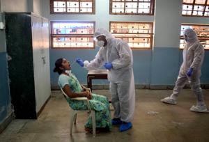 BMC medical staff conduct swab test at Jagannath Shankar Seth Municipal School at Nana chowk, in Mumbai.(ANI) BMC medical staff conduct swab test at Jagannath Shankar Seth Municipal School at Nana chowk, in Mumbai.(ANI)
