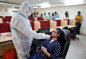 A healthcare worker wearing personal protective equipment (PPE) takes a swab from a woman for a rapid antigen test inside an office, amidst the coronavirus disease (COVID-19) outbreak, in Ahmedabad, India, September 2, 2020. (Representational image)(REUTERS) A healthcare worker wearing personal protective equipment (PPE) takes a swab from a woman for a rapid antigen test inside an office, amidst the coronavirus disease (COVID-19) outbreak, in Ahmedabad, India, September 2, 2020. (Representational image)(REUTERS)