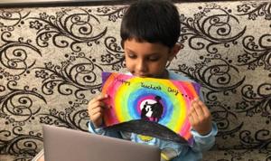 Kids prepared posters and cards to show them to their teacher as celebrations go virtual this year. Kids prepared posters and cards to show them to their teacher as celebrations go virtual this year.