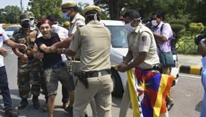 Police personnel try to control a Tibetan national who was protesting outside Chinese embassy in New Delhi on September 5.(PTI) Police personnel try to control a Tibetan national who was protesting outside Chinese embassy in New Delhi on September 5.(PTI)