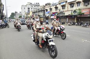 Punjab police personnel conduct a flag march at Queens Road during the weekend lockdown in Amritsar on Saturday.(Sameer Sehgal/HT) Punjab police personnel conduct a flag march at Queens Road during the weekend lockdown in Amritsar on Saturday.(Sameer Sehgal/HT)