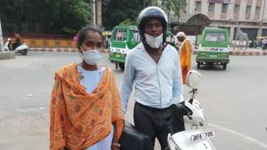 Dhanajay Kumar and his wife with their two-wheeler in Gwalior in Madhya Pradesh.(HT Photo) Dhanajay Kumar and his wife with their two-wheeler in Gwalior in Madhya Pradesh.(HT Photo)