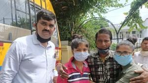 Assistant sub-inspector Rajesh Kumar from Panchkula’s Anti Human Trafficking Unit (left) and two girls who reunited with their father after six years on Sunday.(HT Photo) Assistant sub-inspector Rajesh Kumar from Panchkula’s Anti Human Trafficking Unit (left) and two girls who reunited with their father after six years on Sunday.(HT Photo)