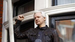 Julian Assange greets supporters outside the Ecuadorian embassy in London.(AP) Julian Assange greets supporters outside the Ecuadorian embassy in London.(AP)