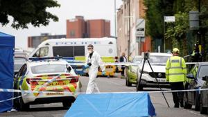 Police officers and a forensic worker are seen at the scene of reported stabbings in Birmingham, Britain.(Reuters image) Police officers and a forensic worker are seen at the scene of reported stabbings in Birmingham, Britain.(Reuters image)
