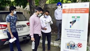 An official checks the documents of a candidate appearing for JEE Mains in Amritsar on September 2.(Sameer Sehgal/ HT photo) An official checks the documents of a candidate appearing for JEE Mains in Amritsar on September 2.(Sameer Sehgal/ HT photo)
