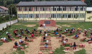 Mirza Begovic teaches a class at an elementary school in an open-air classroom.(REUTERS) Mirza Begovic teaches a class at an elementary school in an open-air classroom.(REUTERS)
