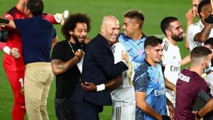 Real Madrid's Marcelo with coach Zinedine Zidane celebrate after winning La Liga.(REUTERS) Real Madrid's Marcelo with coach Zinedine Zidane celebrate after winning La Liga.(REUTERS)