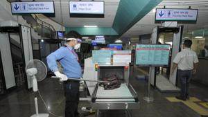 The commuters are now required to put all their belongings such as bags, mobile phones or any other metallic objects, like keys, in trays for checking, much like the checking counters at airports.(Sunil Ghosh/HT Photo) The commuters are now required to put all their belongings such as bags, mobile phones or any other metallic objects, like keys, in trays for checking, much like the checking counters at airports.(Sunil Ghosh/HT Photo)