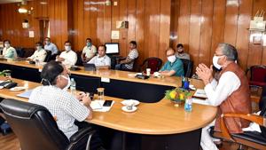 Uttarakhand chief minister Trivendra Singh Rawat chairs a meeting with district magistrate to review the Covid-19 situation.(ANI) Uttarakhand chief minister Trivendra Singh Rawat chairs a meeting with district magistrate to review the Covid-19 situation.(ANI)