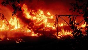 Flames consume a home and car as the Bear Fire burns through the Berry Creek area of Butte County, Calif., on Wednesday, Sept. 9, 2020.(AP photo) Flames consume a home and car as the Bear Fire burns through the Berry Creek area of Butte County, Calif., on Wednesday, Sept. 9, 2020.(AP photo)