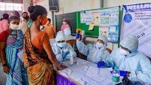 Mumbai: Healthcare workers check temperature of labourers at a camp, organised in an effort to control the spread of new coronavirus, in Mumbai, Sunday, June 21, 2020. (PTI Photo) (PTI21-06-2020_000240A)(PTI) Mumbai: Healthcare workers check temperature of labourers at a camp, organised in an effort to control the spread of new coronavirus, in Mumbai, Sunday, June 21, 2020. (PTI Photo) (PTI21-06-2020_000240A)(PTI)